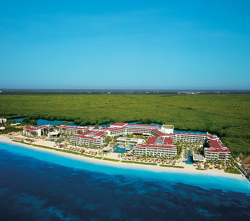 Breathless Riviera Cancun adults-only all-inclusive resort with vibrant pool scene, modern architecture, and beachfront party atmosphere near Cancun.