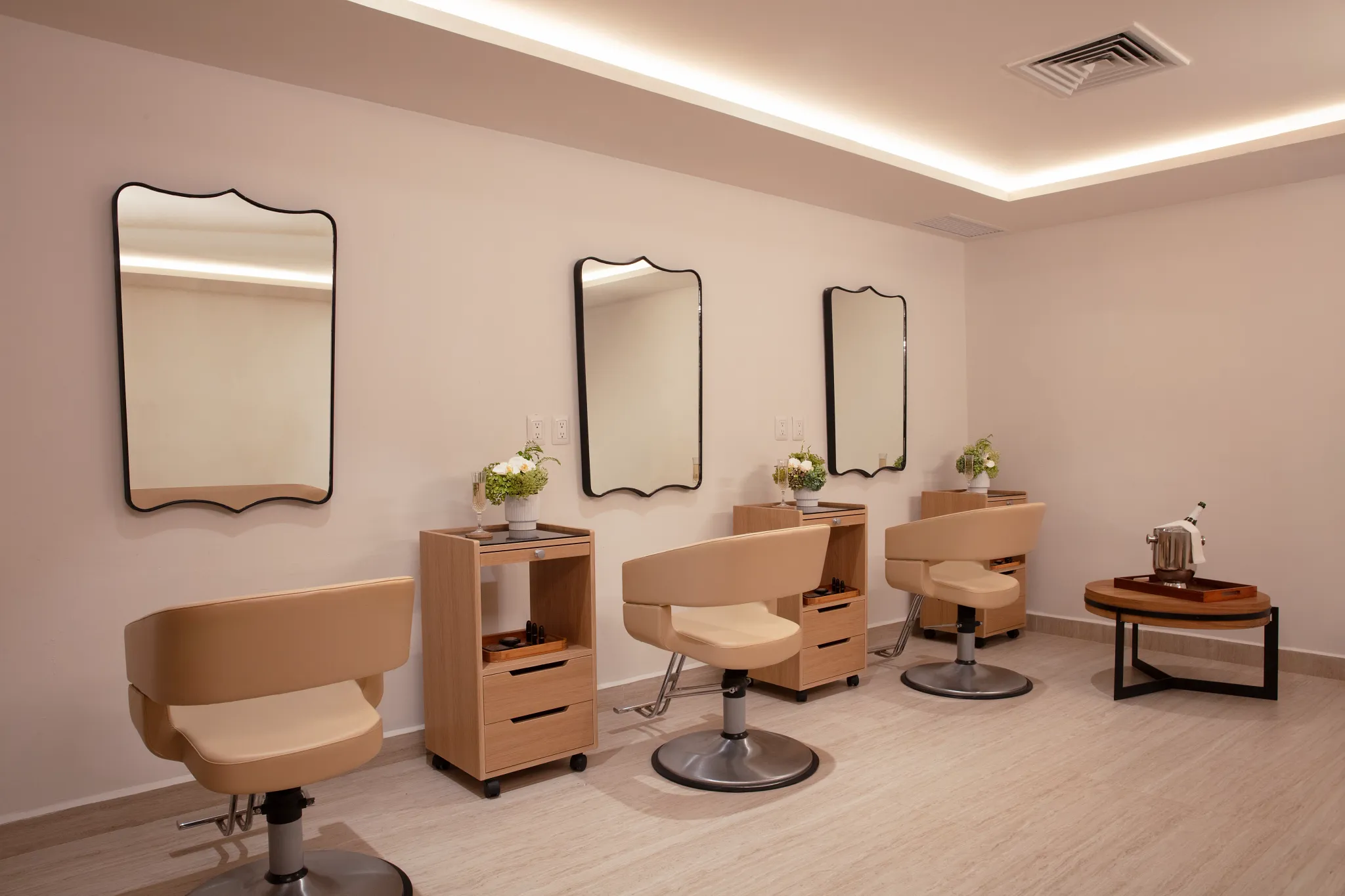 Bridal salon with styling chairs, mirrors, and vanity stations at the resort spa.