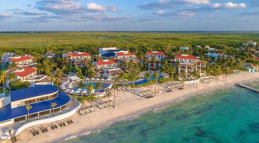 Desire Riviera Maya adults-only clothing-optional lifestyle resort with beachfront setting and sensual atmosphere near Puerto Morelos, Mexico.