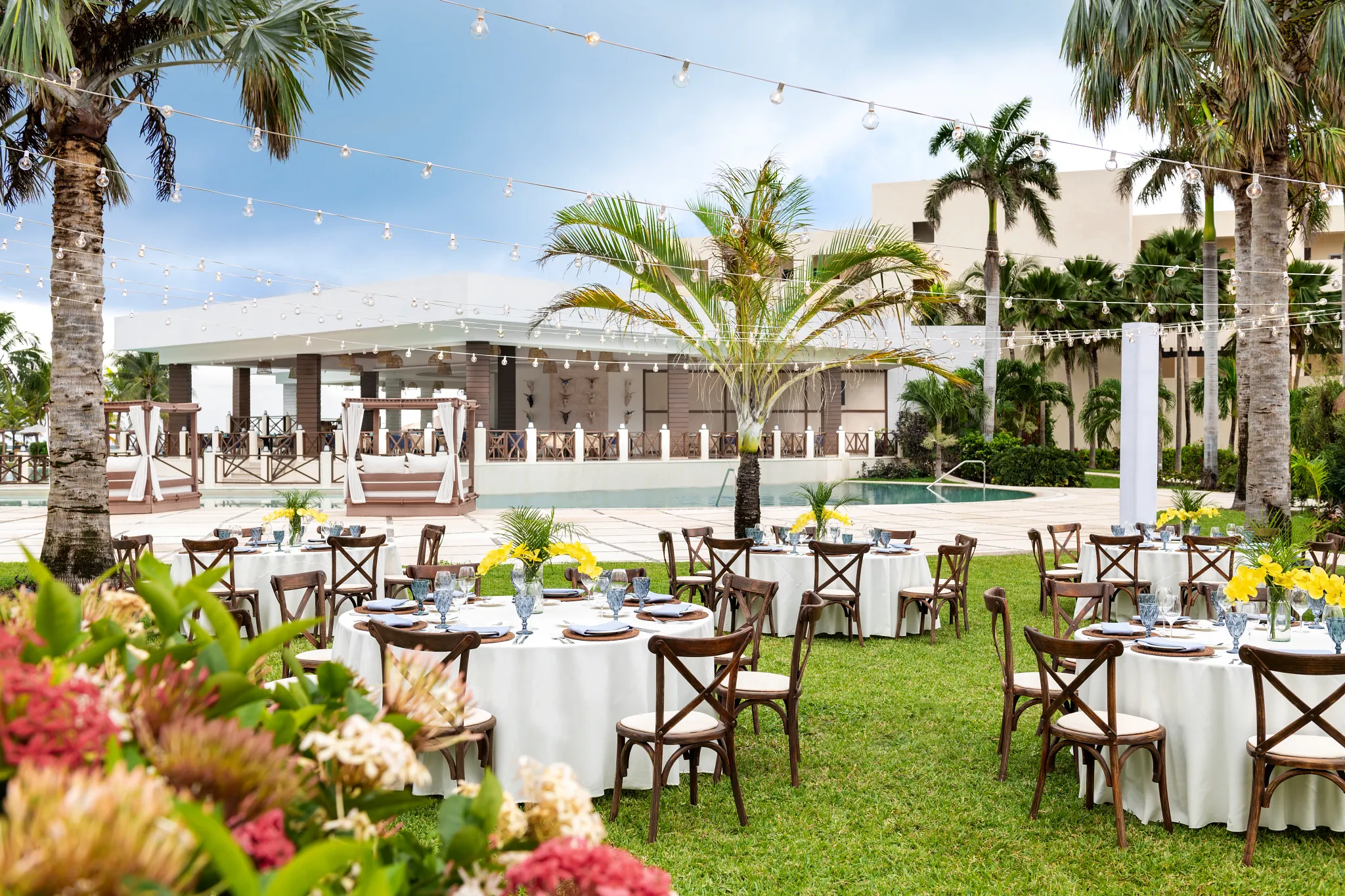 Guava Garden outdoor wedding ceremony setup with tropical greenery at Dreams Puerto Morelos Resort & Spa
