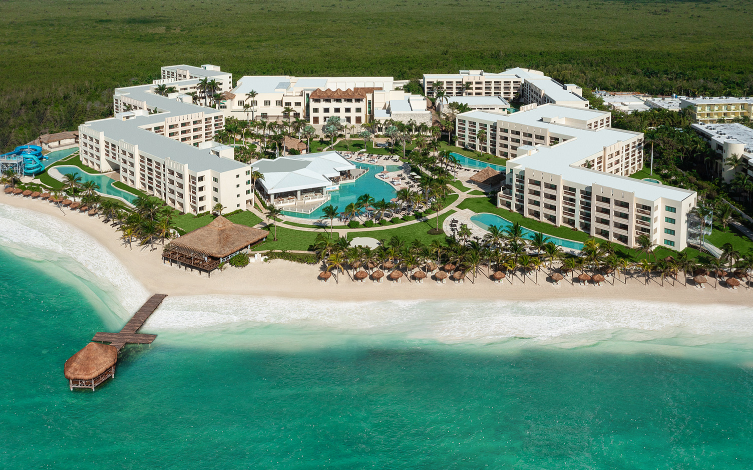Hyatt Ziva Riviera Cancun all-inclusive resort with oceanfront pools, modern architecture, and family-friendly amenities near Cancun.