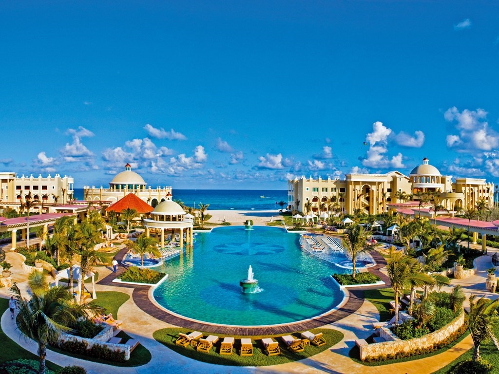 Iberostar Grand Paraiso adults-only all-inclusive resort with colonial architecture, manicured gardens, and beachfront setting on the Riviera Maya.