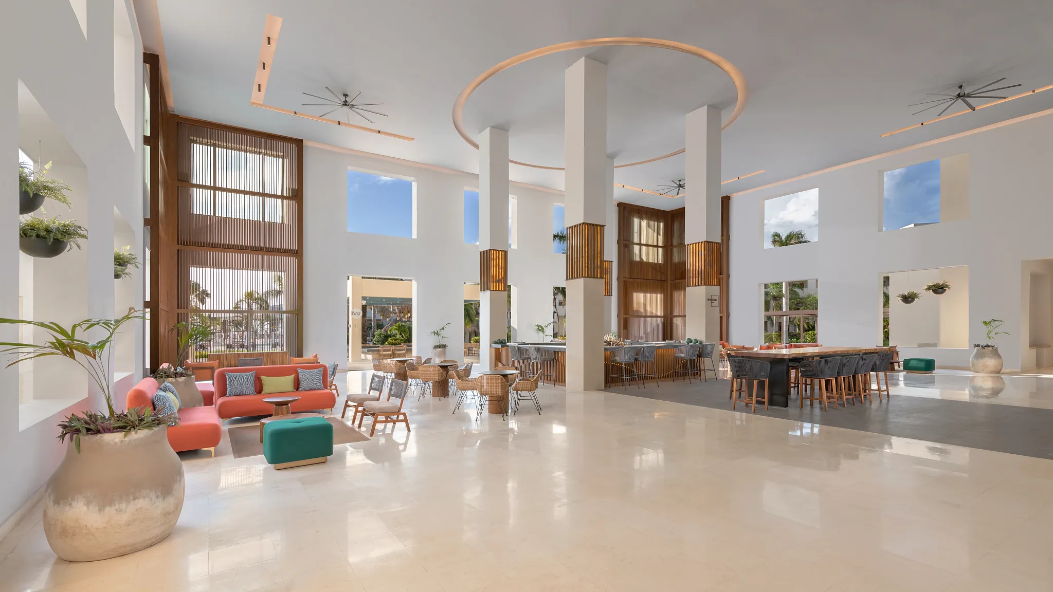 Spacious lobby lounge with seating areas and modern decor at Dreams Puerto Morelos Resort & Spa.