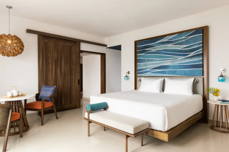Preferred Club Master Suite Ocean Front king bedroom with modern furnishings at Dreams Puerto Morelos.