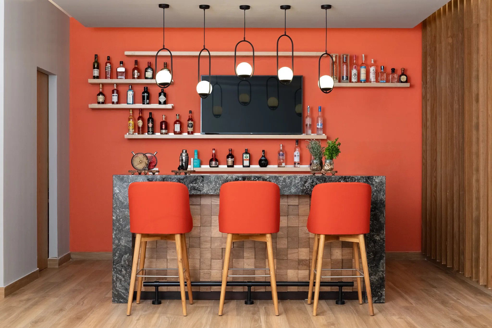 Preferred Club VIP Lounge bar at Dreams Puerto Morelos Resort & Spa featuring modern seating, premium liquor display, and stylish indoor design.