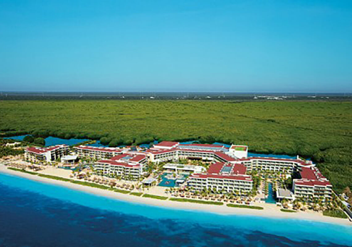 Secrets Riviera Cancun adults-only all-inclusive resort with oceanfront pools, elegant suites, and romantic beachfront setting near Puerto Morelos.